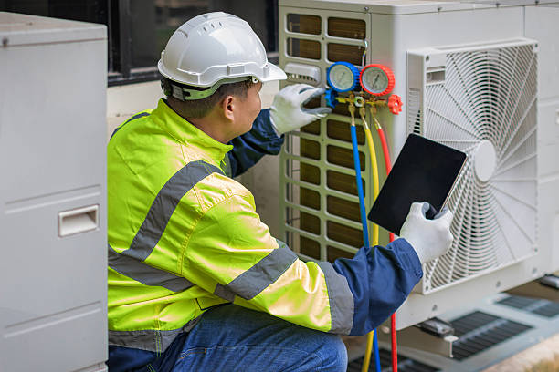 Professional Heat Pump Repair technician working in Howells, NY
